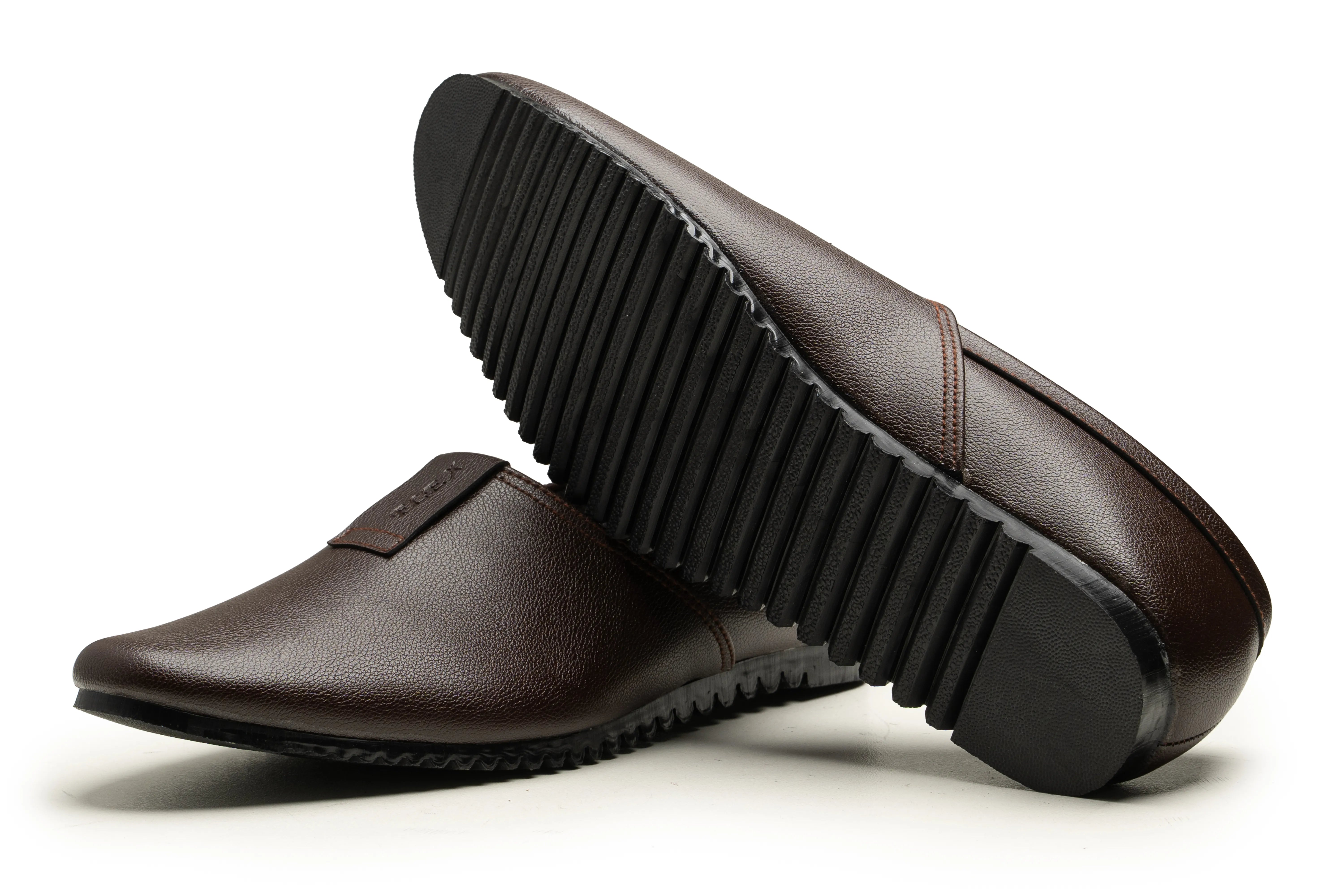 A pair of dark brown leather slip-on loafers shown on a white background, with one shoe positioned to display the textured black sole.