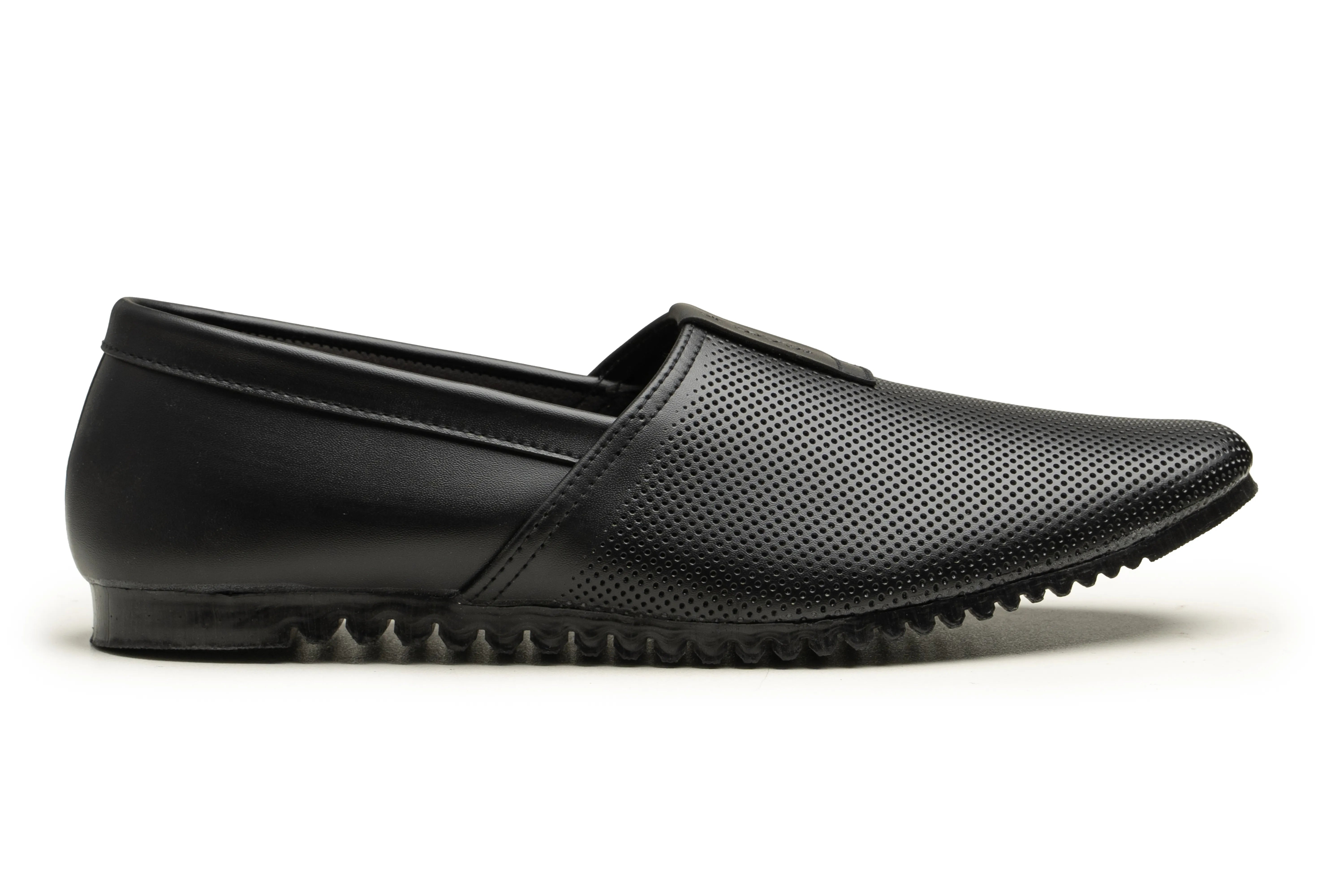 A single black slip-on shoe with perforated upper material and a textured sole, shown in profile against a white background.
