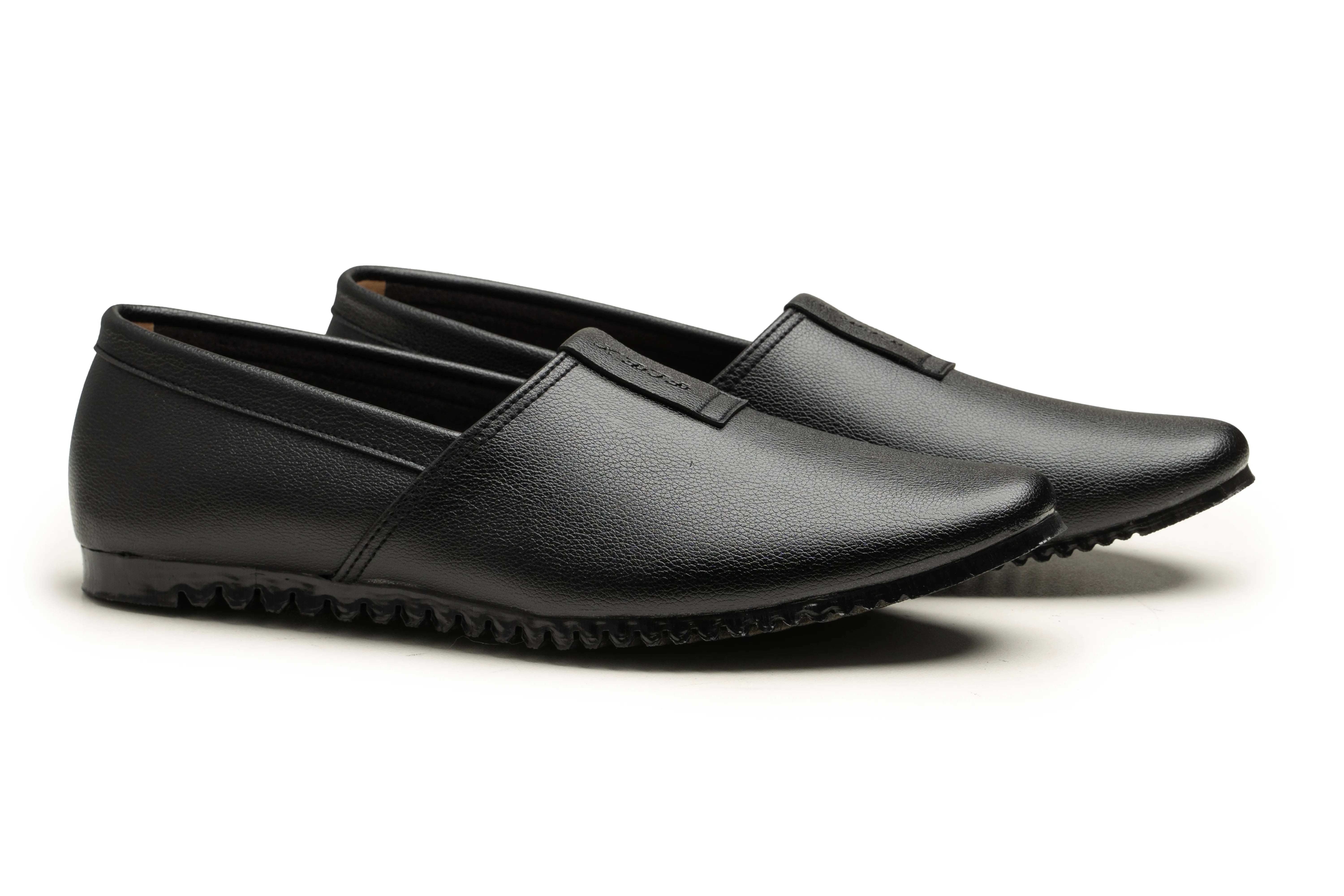 A pair of black leather slip-on loafers with a textured sole, displayed on a clean white background.