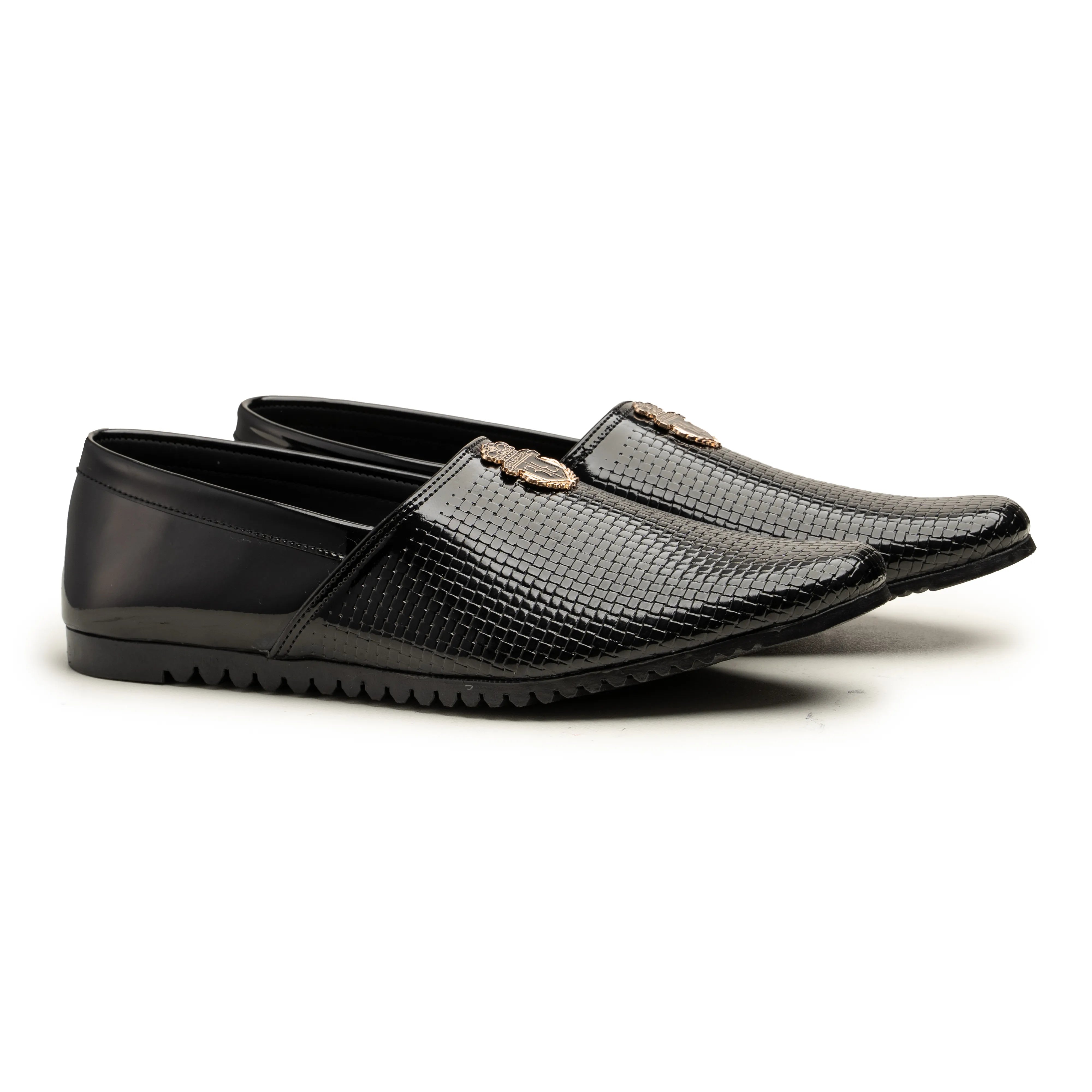 A pair of men's black slip-on loafers, featuring a glossy textured leather upper with a small gold-tone metal horsebit detail on the vamp, set against a plain white background.