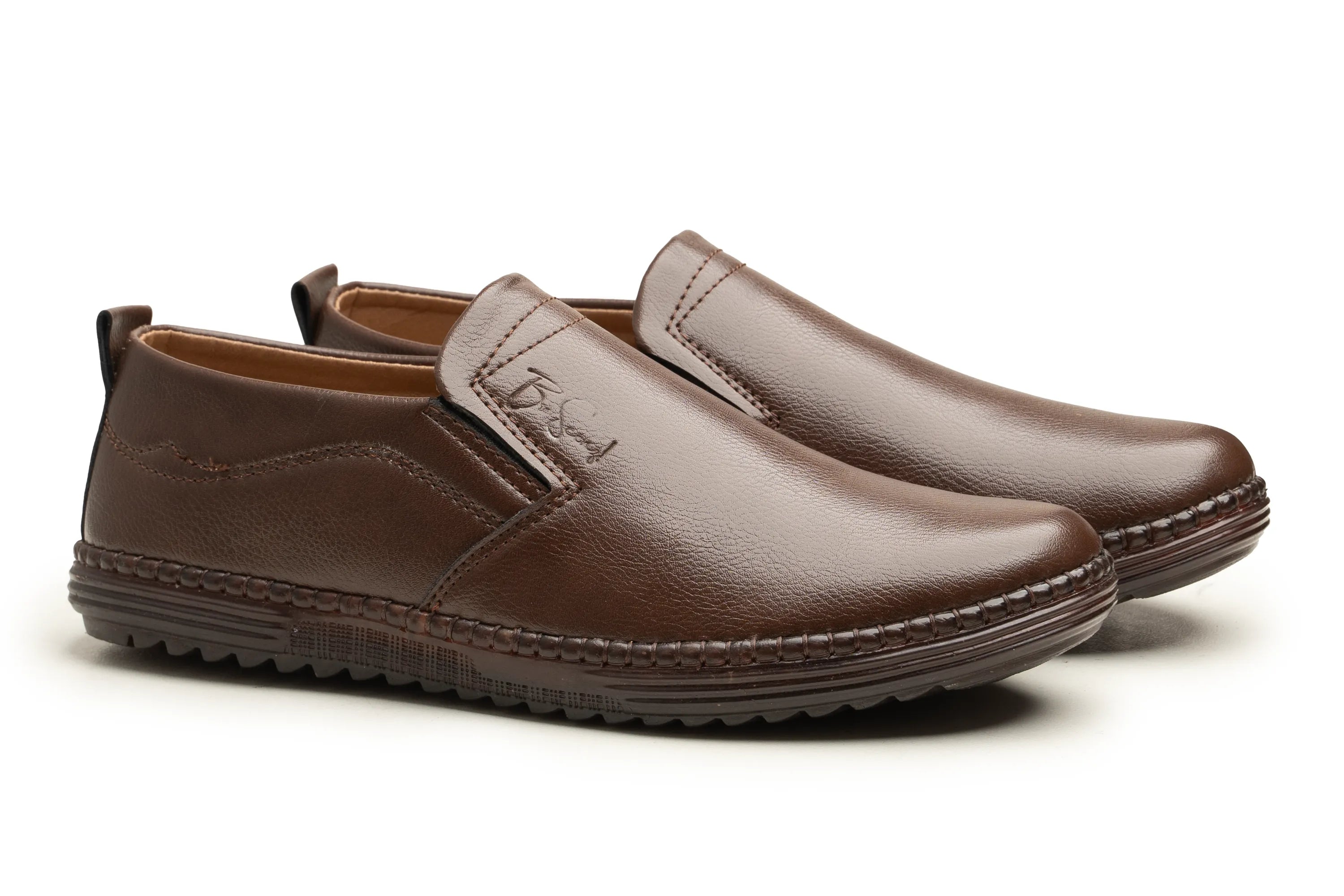 A pair of men's brown leather slip-on shoes with a textured sole, shown on a clean white background.