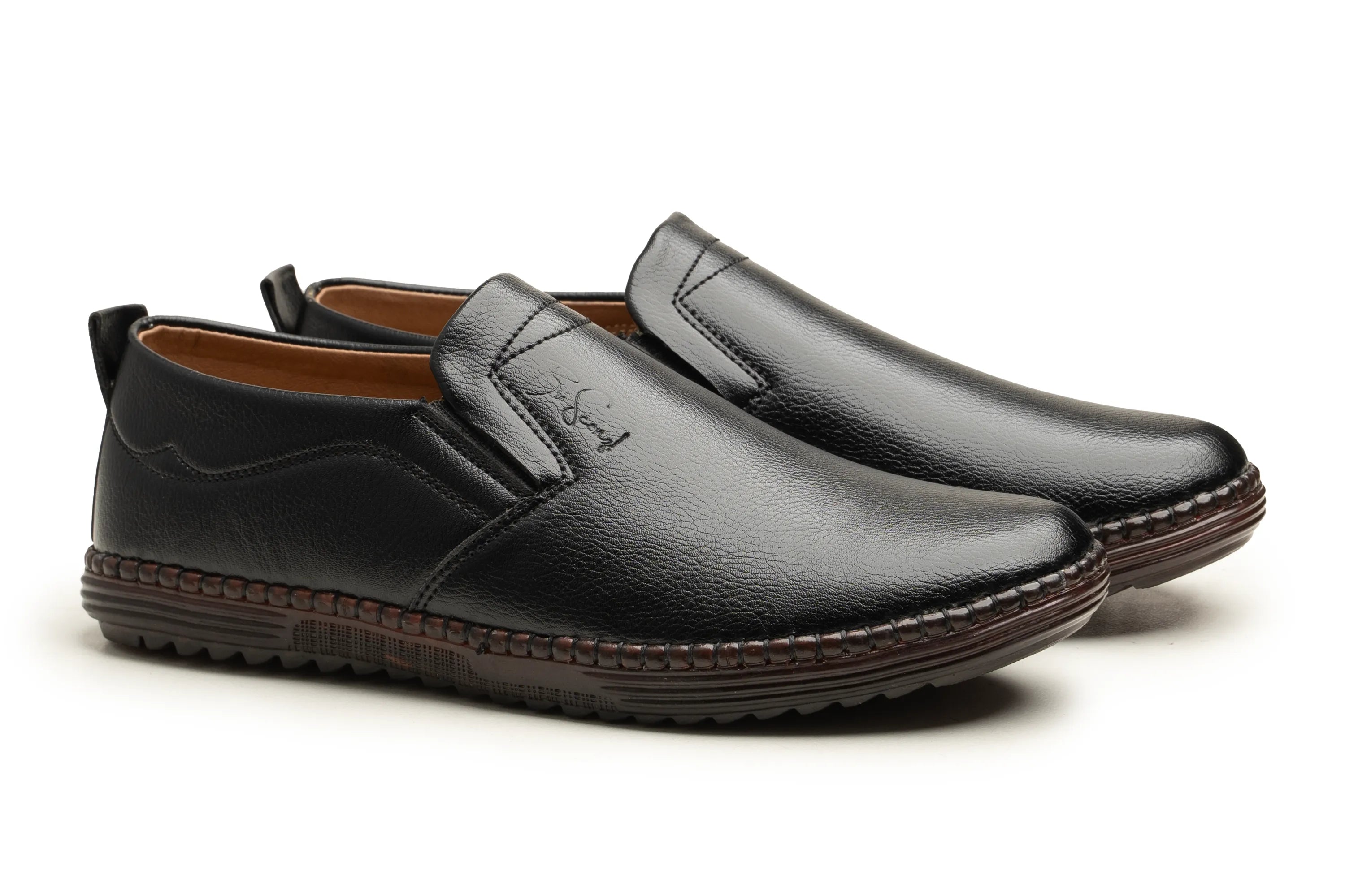 A pair of men's black slip-on loafers with a pebbled leather finish, brown stitching around the sole, and a tan interior lining, shown on a white background.
